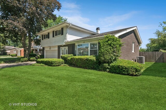 1826 E Tano Ln, Mount Prospect, IL 60056 - view of front facade with brick siding, a garage, and a chimney