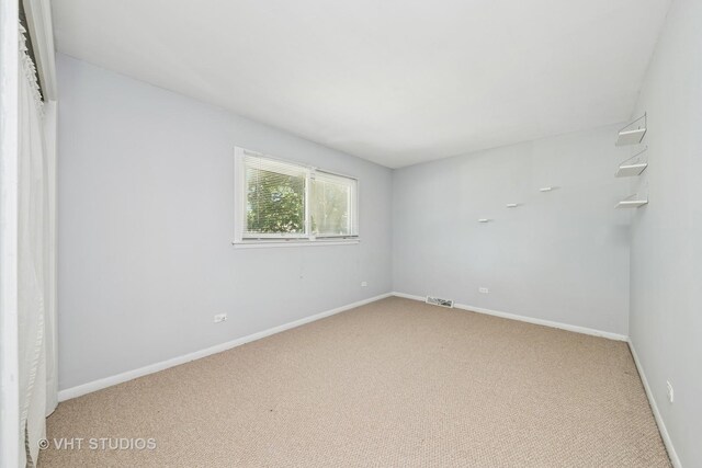 1826 E Tano Ln, Mount Prospect, IL 60056 - spare room with light carpet