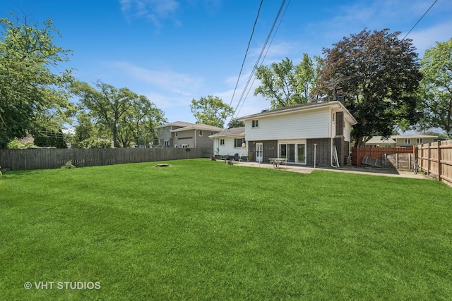 1826 E Tano Ln, Mount Prospect, IL 60056 - rear view of house featuring a patio, a fenced backyard, brick siding, and a chimney