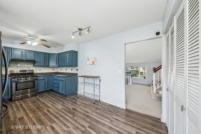 1826 E Tano Ln, Mount Prospect, IL 60056 - kitchen featuring appliances with stainless steel finishes, blue cabinetry, dark wood-type flooring, a ceiling fan, and backsplash