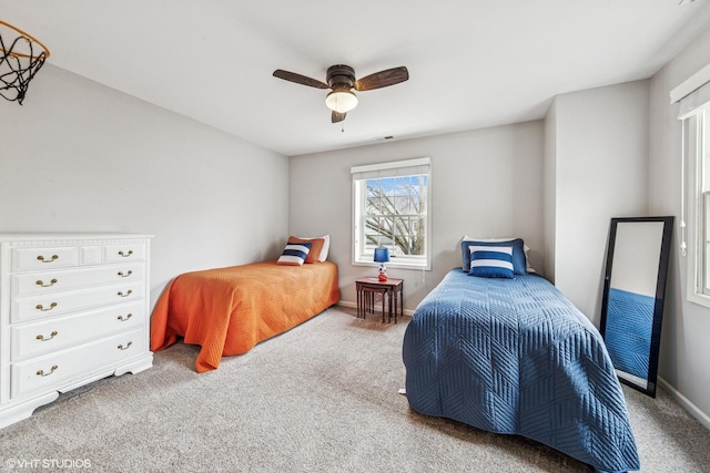 bedroom with carpet, ceiling fan, and baseboards