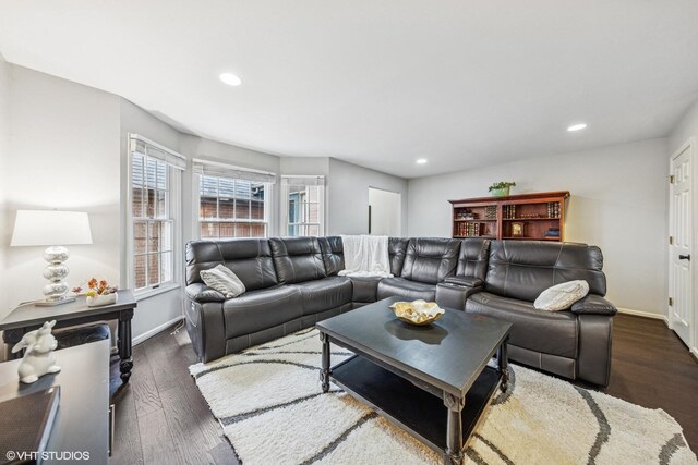 living room featuring baseboards, recessed lighting, and dark wood-type flooring
