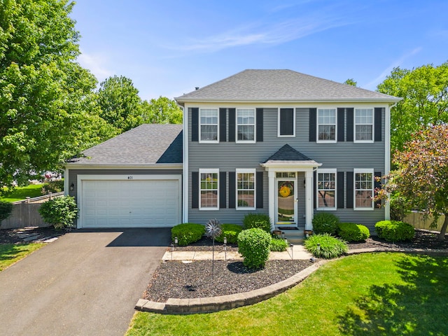 401 Manchester Rd, Oswego, IL 60543 - colonial-style house with driveway, a garage, and a shingled roof