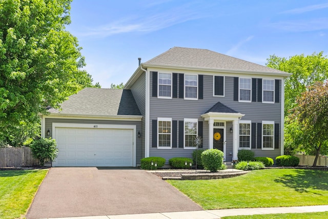 401 Manchester Rd, Oswego, IL 60543 - colonial house featuring driveway and an attached garage