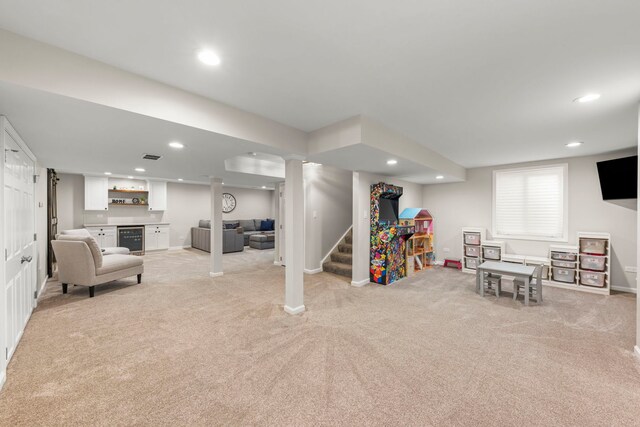401 Manchester Rd, Oswego, IL 60543 - rec room featuring beverage cooler, a bar, light colored carpet, recessed lighting, and baseboards