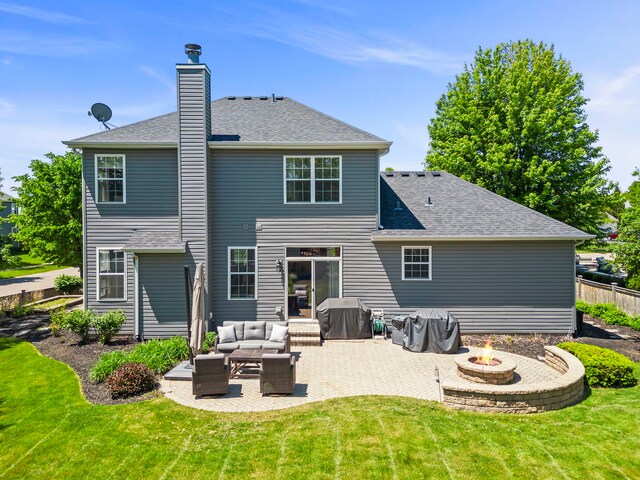 401 Manchester Rd, Oswego, IL 60543 - back of property with a patio, an outdoor living space with a fire pit, a chimney, and a shingled roof