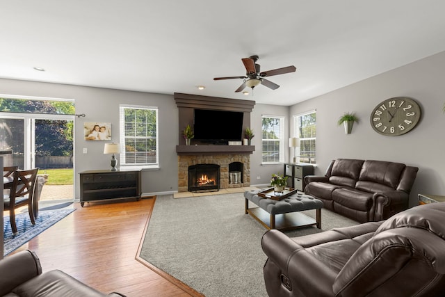 401 Manchester Rd, Oswego, IL 60543 - living area with wood finished floors, ceiling fan, a fireplace, and baseboards
