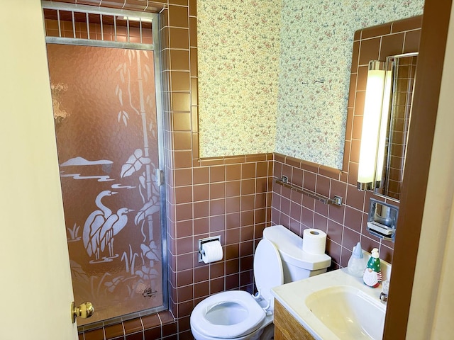 6600 N Kenton Ave, Lincolnwood, IL 60712 - bathroom with a stall shower, tile walls, toilet, and vanity