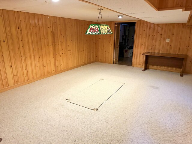 6600 N Kenton Ave, Lincolnwood, IL 60712 - finished below grade area with carpet flooring, wooden walls, and baseboards