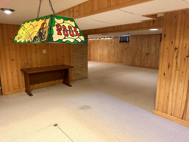 6600 N Kenton Ave, Lincolnwood, IL 60712 - finished basement featuring wooden walls, baseboards, and carpet