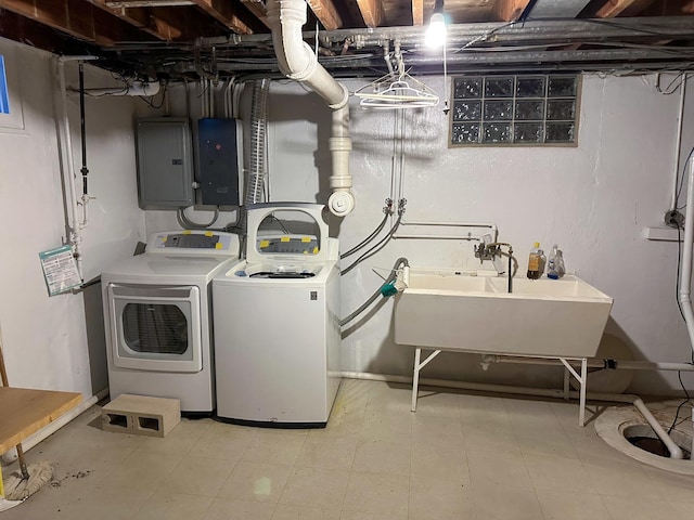 6600 N Kenton Ave, Lincolnwood, IL 60712 - washroom featuring electric panel, washing machine and dryer, and tile patterned floors