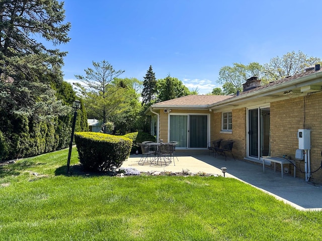6600 N Kenton Ave, Lincolnwood, IL 60712 - view of green lawn featuring a patio