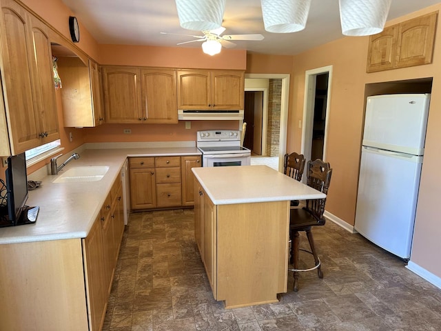 6600 N Kenton Ave, Lincolnwood, IL 60712 - kitchen featuring white appliances, a sink, stone finish flooring, and under cabinet range hood