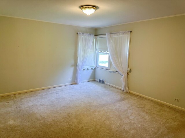6600 N Kenton Ave, Lincolnwood, IL 60712 - spare room with ornamental molding, carpet, and baseboards
