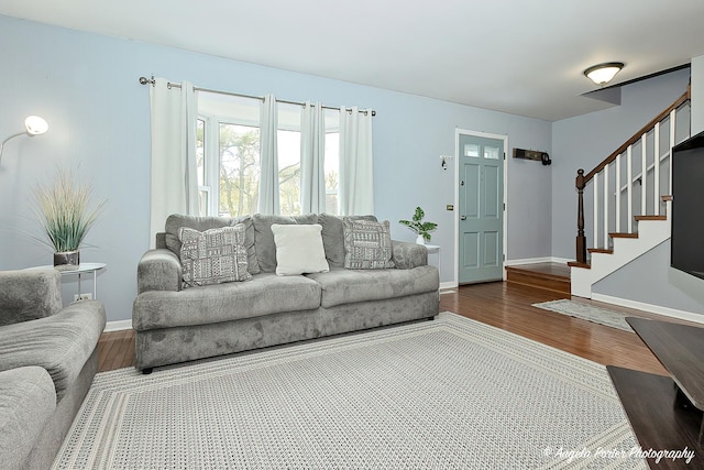 716 Lagoon Ter, Round Lake Beach, IL 60073 - living area featuring wood finished floors, stairway, and baseboards