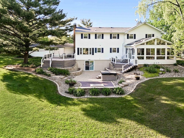 19423 Lakeside Ln, Bloomington, IL 61705 - rear view of house featuring a hot tub, stairway, a patio area, a sunroom, and a wooden deck