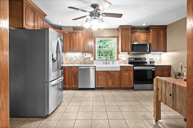 19423 Lakeside Ln, Bloomington, IL 61705 - kitchen with stainless steel appliances, a sink, light countertops, tasteful backsplash, and recessed lighting