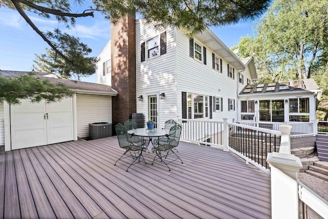 19423 Lakeside Ln, Bloomington, IL 61705 - wooden terrace with a sunroom, outdoor dining area, and cooling unit