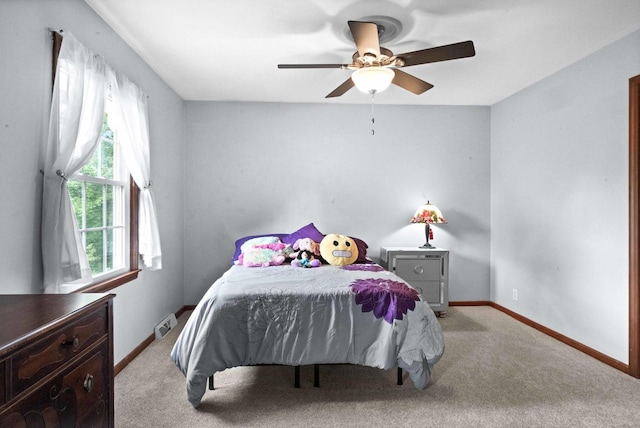 19423 Lakeside Ln, Bloomington, IL 61705 - bedroom featuring light colored carpet, baseboards, and ceiling fan