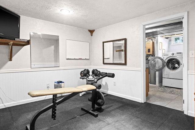 19423 Lakeside Ln, Bloomington, IL 61705 - exercise room with a wainscoted wall and a textured ceiling
