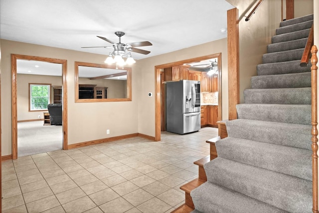 19423 Lakeside Ln, Bloomington, IL 61705 - staircase with a ceiling fan, baseboards, and tile patterned flooring