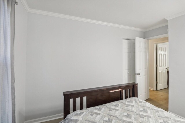 35634 N Greenleaf Ave, Ingleside, IL 60041 - bedroom with ornamental molding, wood finished floors, and baseboards