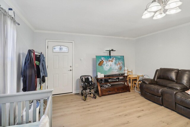 35634 N Greenleaf Ave, Ingleside, IL 60041 - living room featuring light wood-style flooring, a chandelier, and crown molding