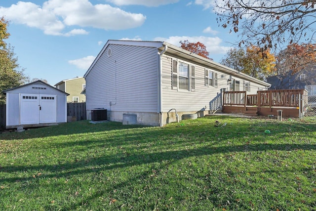 35634 N Greenleaf Ave, Ingleside, IL 60041 - rear view of property featuring a storage shed, a deck, an outdoor structure, and cooling unit