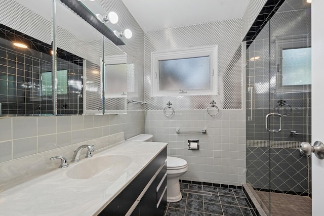 9032 Crawford Ave, Skokie, IL 60076 - full bath featuring tile walls, a shower stall, toilet, tile patterned flooring, and vanity