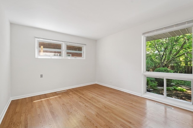 9032 Crawford Ave, Skokie, IL 60076 - empty room with light wood finished floors and baseboards