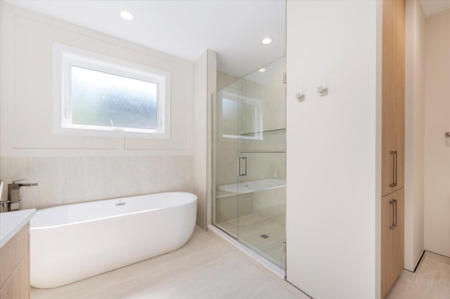 1542 W Highland Ave, Chicago, IL 60660 - full bathroom with a shower stall, a freestanding bath, vanity, and recessed lighting