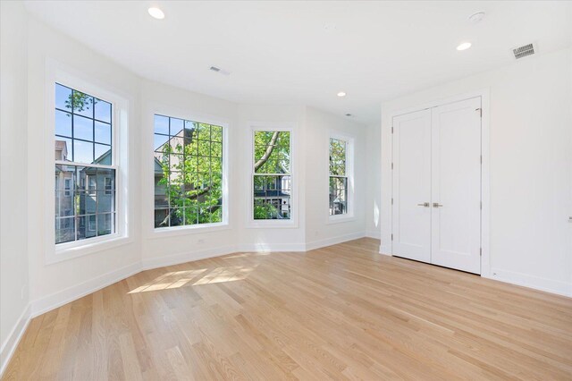 1542 W Highland Ave, Chicago, IL 60660 - unfurnished room featuring light wood finished floors, baseboards, and recessed lighting