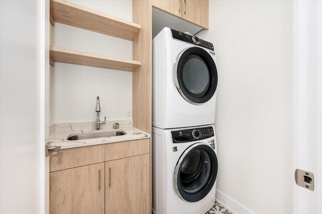 1542 W Highland Ave, Chicago, IL 60660 - clothes washing area featuring stacked washer and clothes dryer and cabinet space