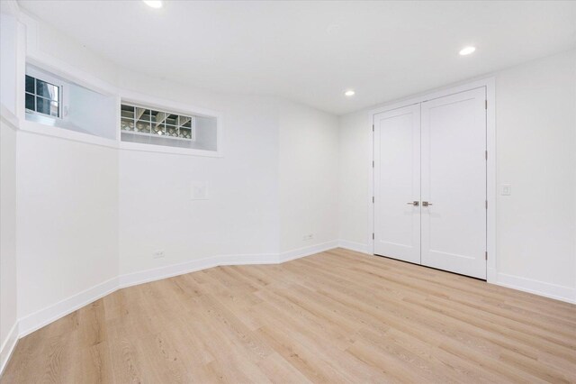 1542 W Highland Ave, Chicago, IL 60660 - unfurnished bedroom featuring wood finished floors, recessed lighting, baseboards, and a closet