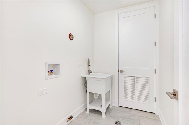1542 W Highland Ave, Chicago, IL 60660 - laundry area with hookup for a washing machine, light marble finish flooring, baseboards, and gas dryer hookup
