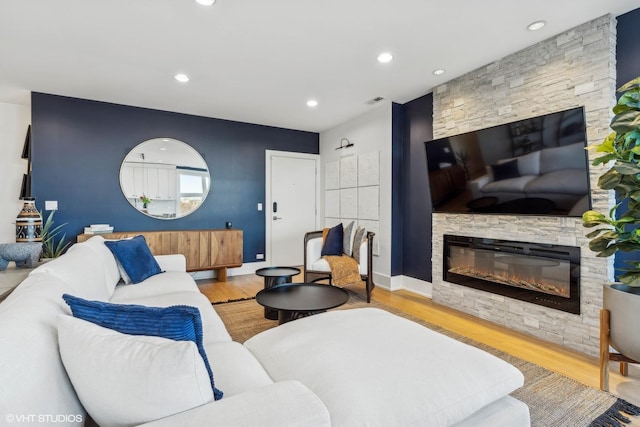 1203 E 46th St Unit 4N, Chicago, IL 60653 - living room featuring a stone fireplace, wood finished floors, and recessed lighting