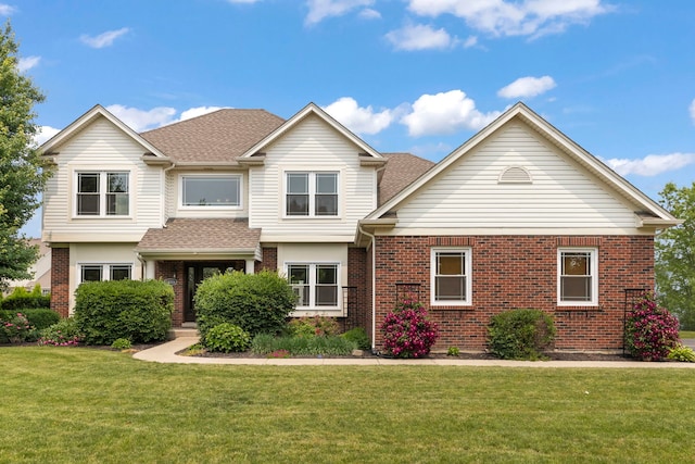 24006 Skyler Ln, Plainfield, IL 60586 - view of front of property with brick siding, a front yard, and roof with shingles
