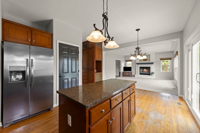 24006 Skyler Ln, Plainfield, IL 60586 - kitchen featuring stainless steel fridge, a center island, light wood-type flooring, and hanging light fixtures