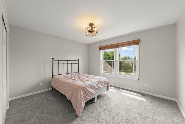 24006 Skyler Ln, Plainfield, IL 60586 - carpeted bedroom with baseboards and a chandelier