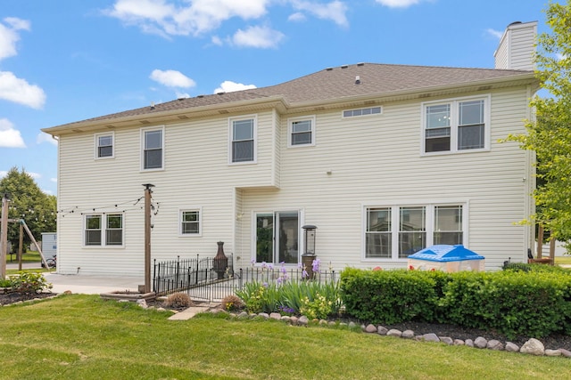 24006 Skyler Ln, Plainfield, IL 60586 - rear view of property featuring a patio area, a lawn, and a chimney