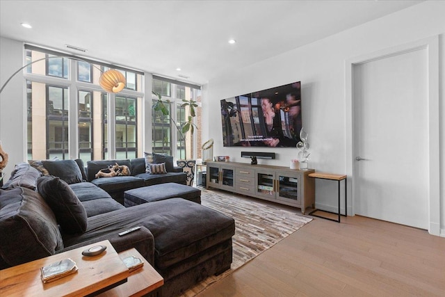 2773 N Hampden Ct Unit Ph03, Chicago, IL 60614 - living area featuring wood finished floors, recessed lighting, and a wall of windows