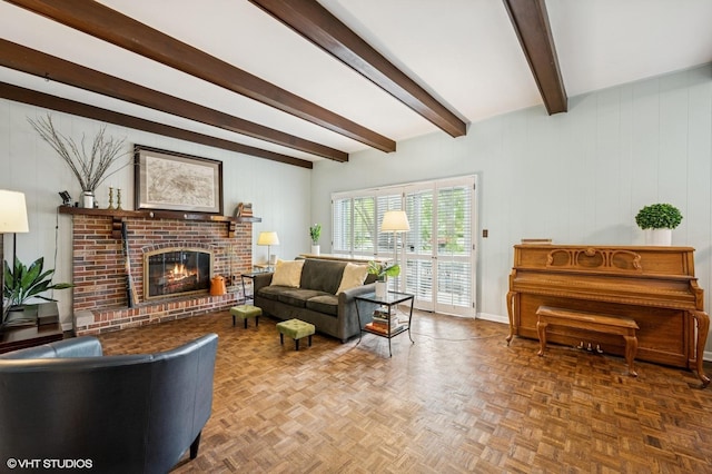 living area with a brick fireplace, beam ceiling, baseboards, and wood walls