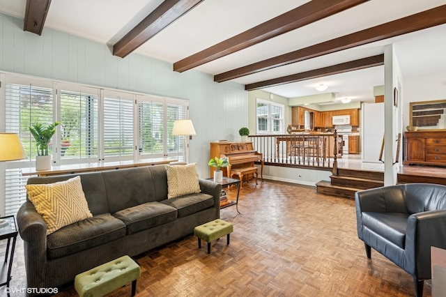 living room with beamed ceiling