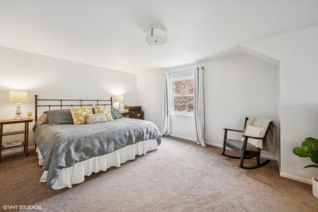 bedroom featuring carpet floors and baseboards
