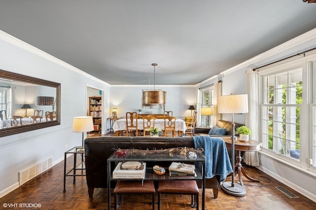 living room featuring baseboards and ornamental molding