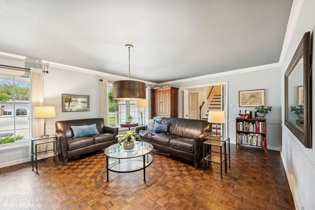 living room featuring baseboards, stairs, and crown molding