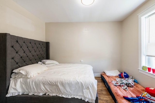 7601 W 60th Pl, Summit, IL 60501 - bedroom with wood finished floors and a baseboard heating unit