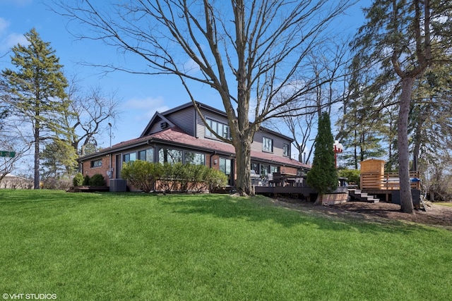 3300 Overland Pass, Northbrook, IL 60062 - back of property featuring a yard, a deck, brick siding, and central AC