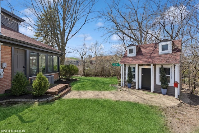 3300 Overland Pass, Northbrook, IL 60062 - view of green lawn with an outdoor structure and central AC