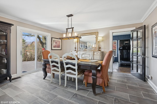 3300 Overland Pass, Northbrook, IL 60062 - dining space with a chandelier, crown molding, and baseboards